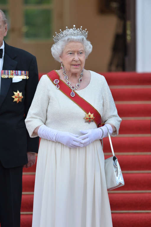 Queen with red sash